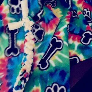 This is a banana, colored and paw print, and bone dog toy